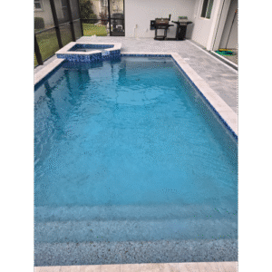 Burnt Store Meadows pool builder custom shotcrete swimming pool with modern design and travertine decking