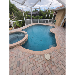 custom pool builder Punta Gorda luxury backyard swimming pool with modern design and spa