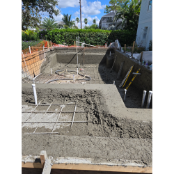 Pool construction showing fresh shotcrete walls and floor structure during installation by H2Oasis Pools & Spas in Burnt Store Meadows, Florida.